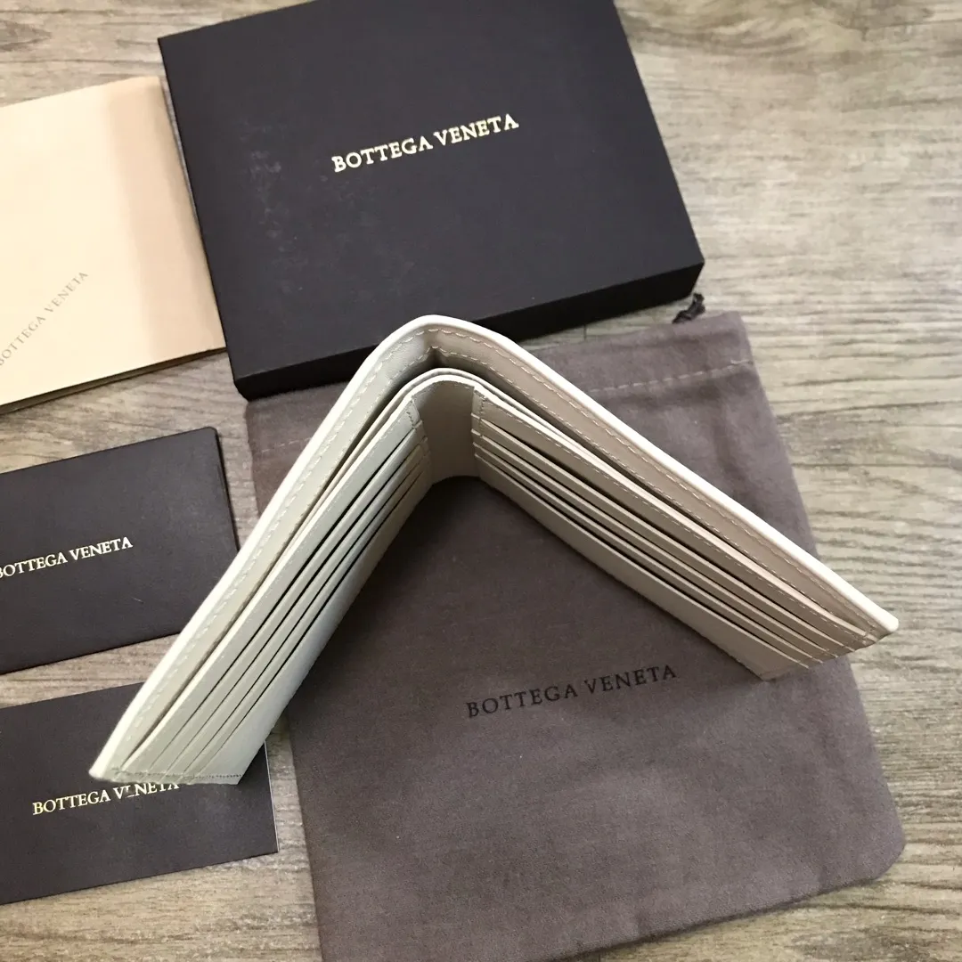 Padded leather wallet • 8 card slots, 1 bill compartment and 2 additional compartments • Check pattern nappa padding exterior • Smooth calfskin lining 778#